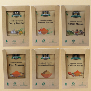 Six boxes of Hektray traditional spices with labels for Curry Powder, Sambar Powder, Garam Masala, Fish Masala, Tikka/Tandoori Masala, and Chicken Masala.